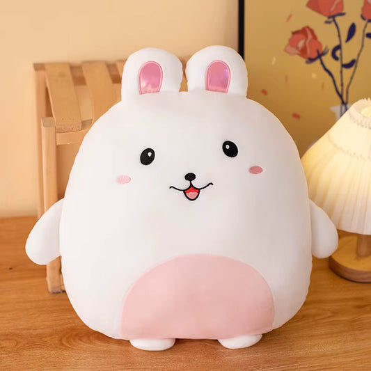 Bunny plush toy resembling a cartoon character with pink cheeks and ears on a wooden surface.