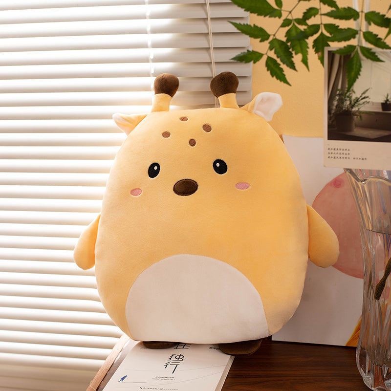 Cute plush toy giraffe on a surface with a window and plant in the background